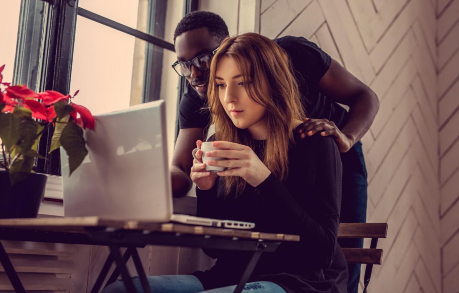 Developer working on mobile application in modern workspace